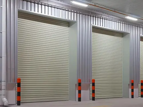 Rolling shutter door installed in a steel building for secure access and loading opening use in warehouse and workshop applications