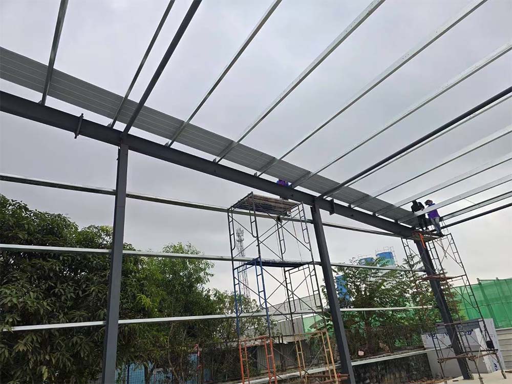 Roof structure detail showing purlins and portal frame connections on a steel building project in Thailand