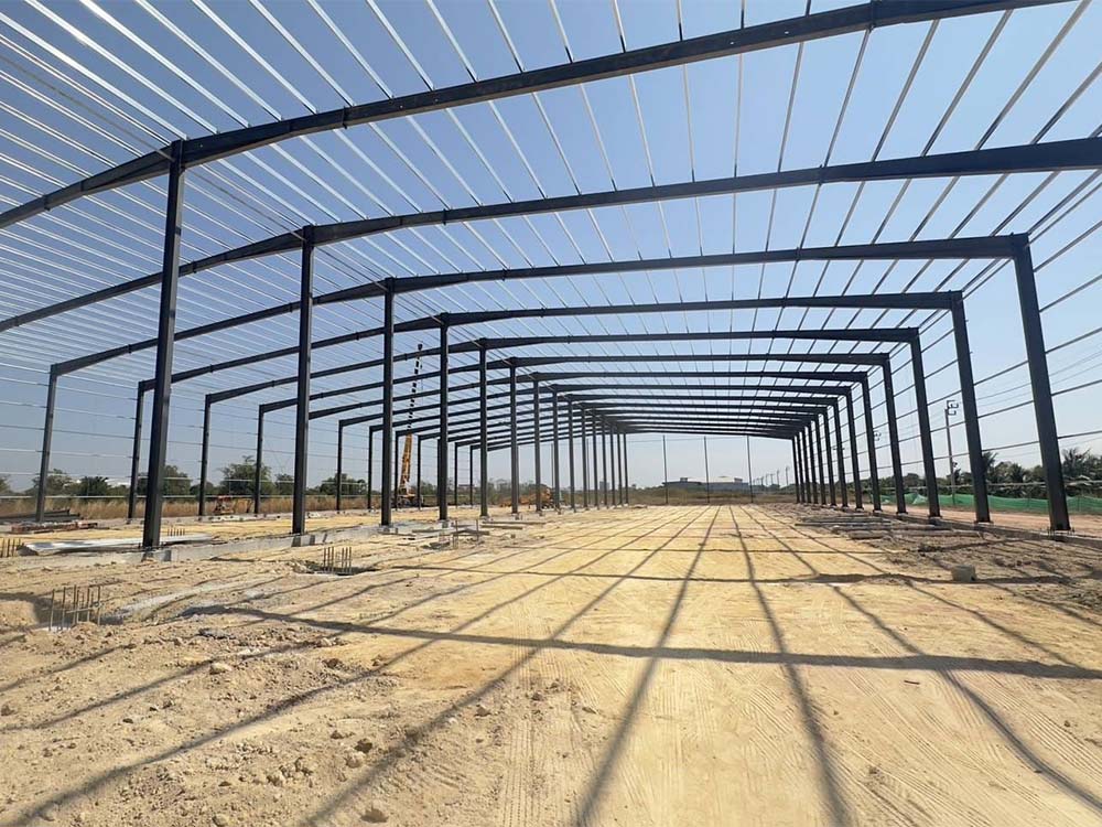 Interior view of steel frame erection for a 60m×155m×8m building in Thailand, installed by the client team