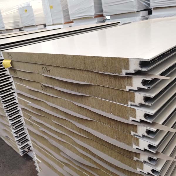 Close-up of rock wool sandwich panels with metal facing and interlocking edge for steel warehouse and workshop buildings