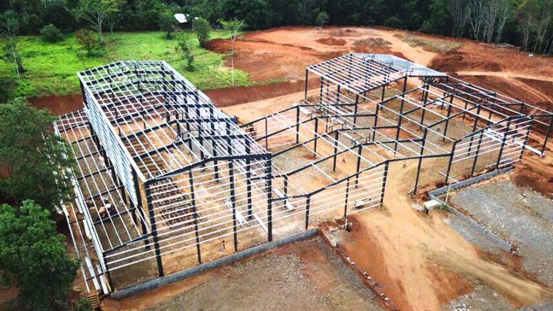 Aerial view of multi-span steel structure erection for a coffee factory project in Nicaragua