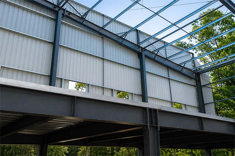 Interior steel structure and wall panel installation view of the factory building project in Brazil